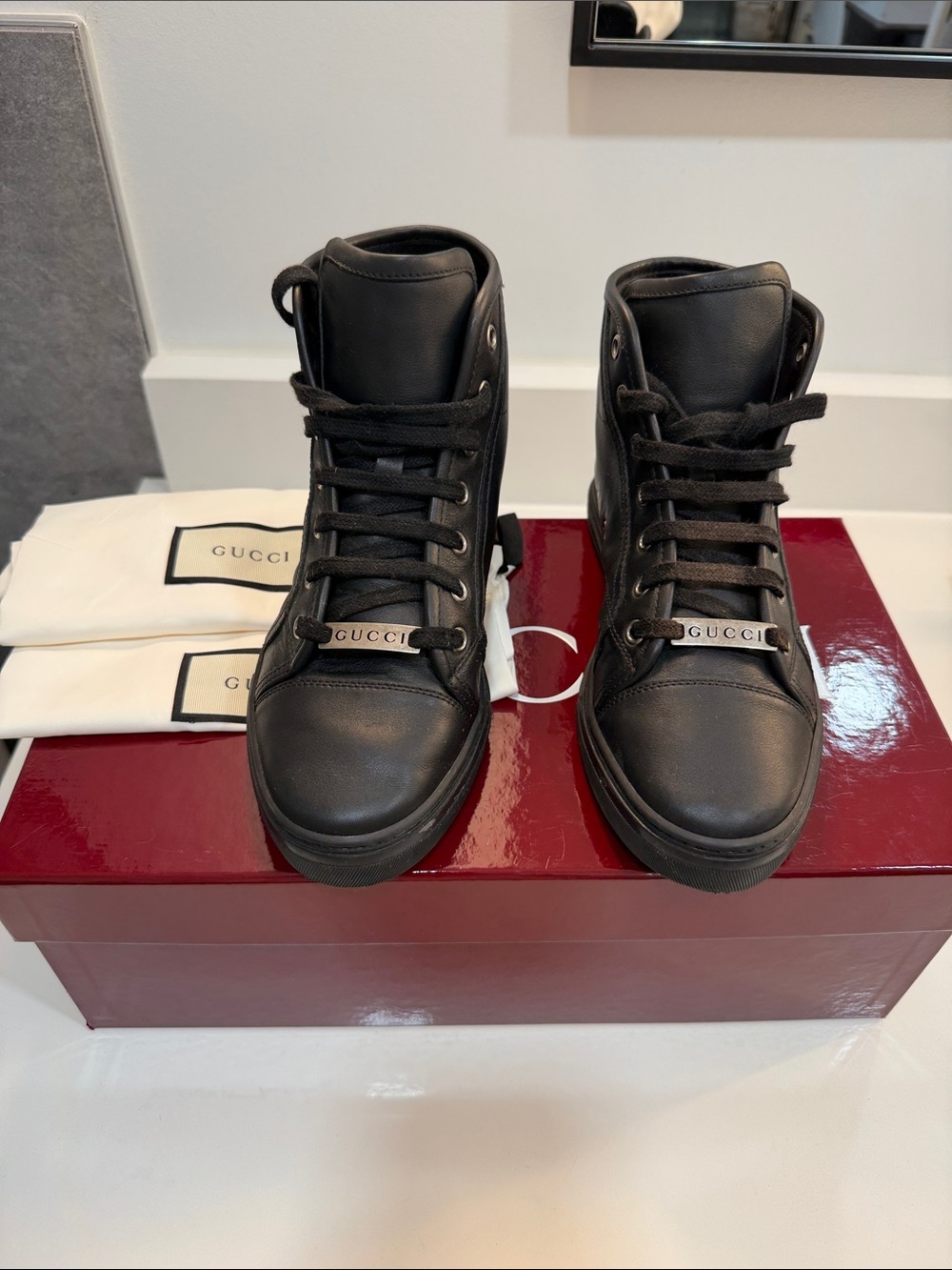 Gucci Black Leather High-Top Sneakers with Branded Lace Plate